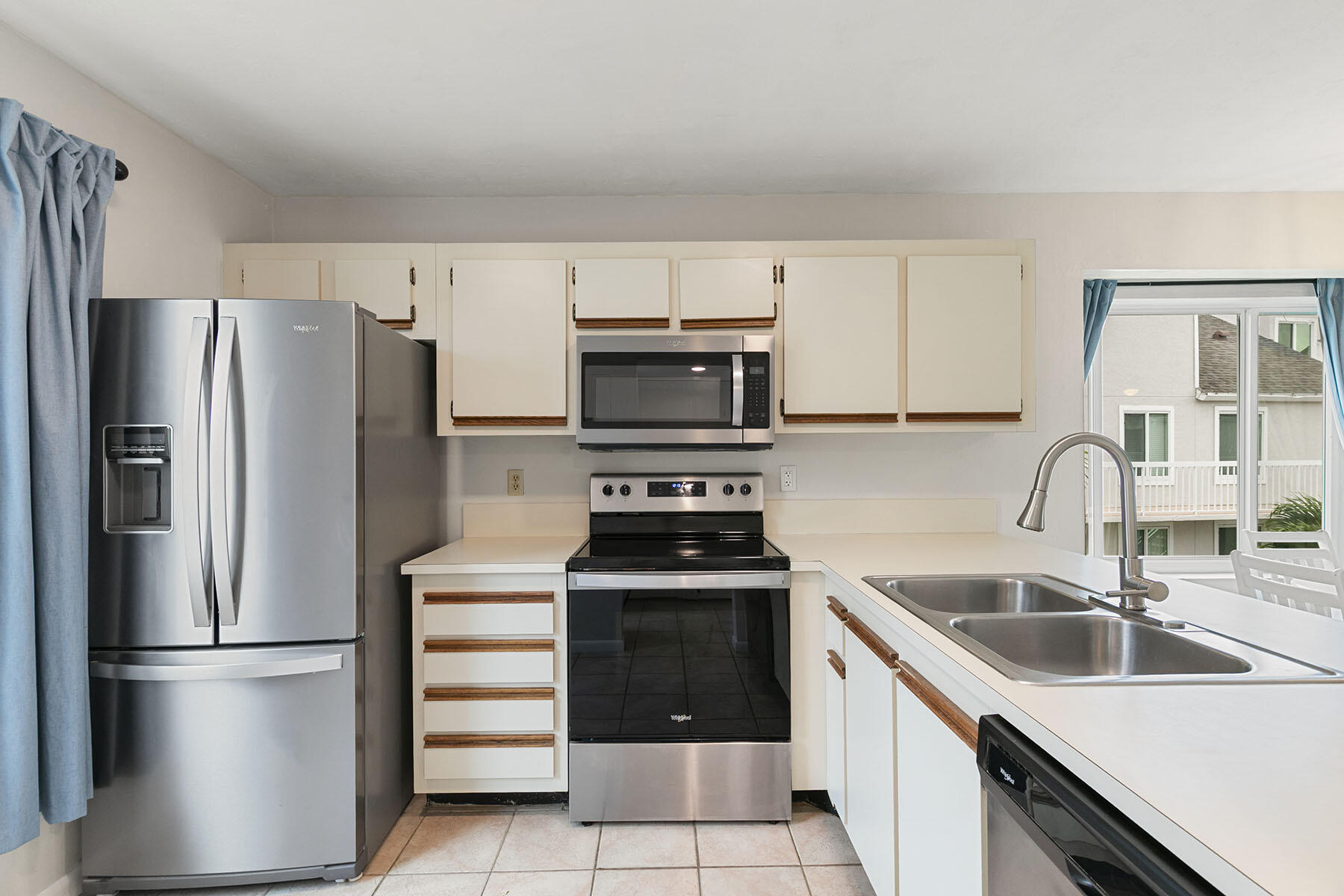2189 San Marco Road, Unit 201 Marco Island, FL 34145 - Photo 13 of 27 a kitchen with a sink stove and refrigerator