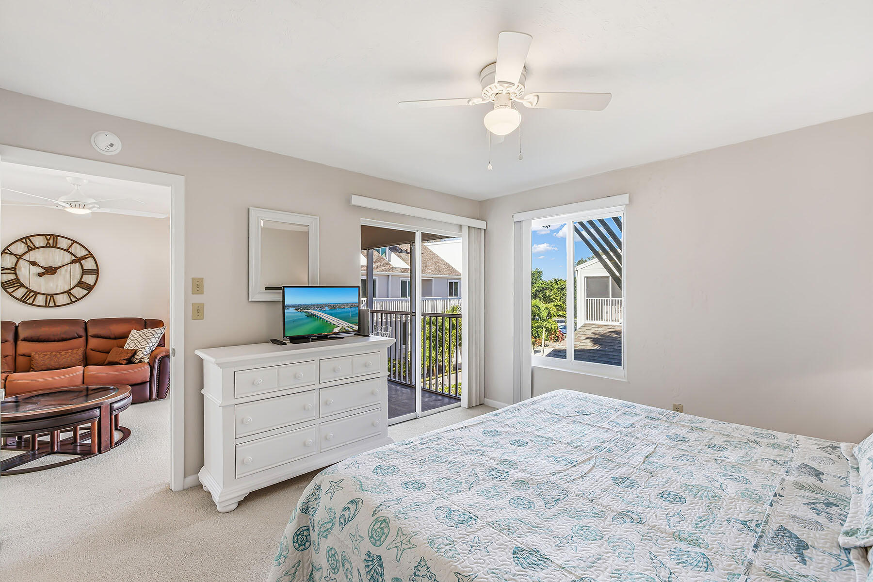 2189 San Marco Road, Unit 201 Marco Island, FL 34145 - Photo 15 of 27 a bedroom with a bed and a large window with the outer view
