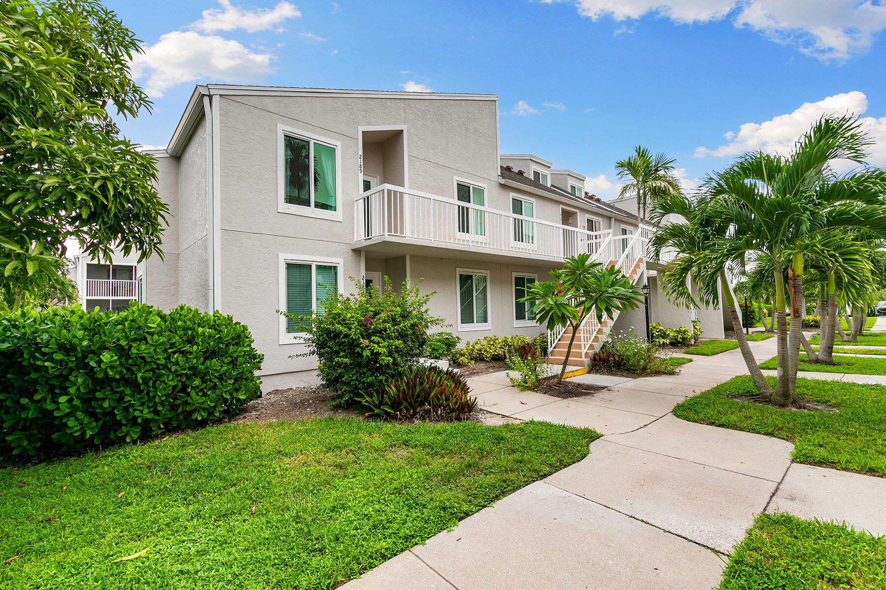 2189 San Marco Road, Unit 201 Marco Island, FL 34145 - Photo 27 of 27 front view of a house with a yard