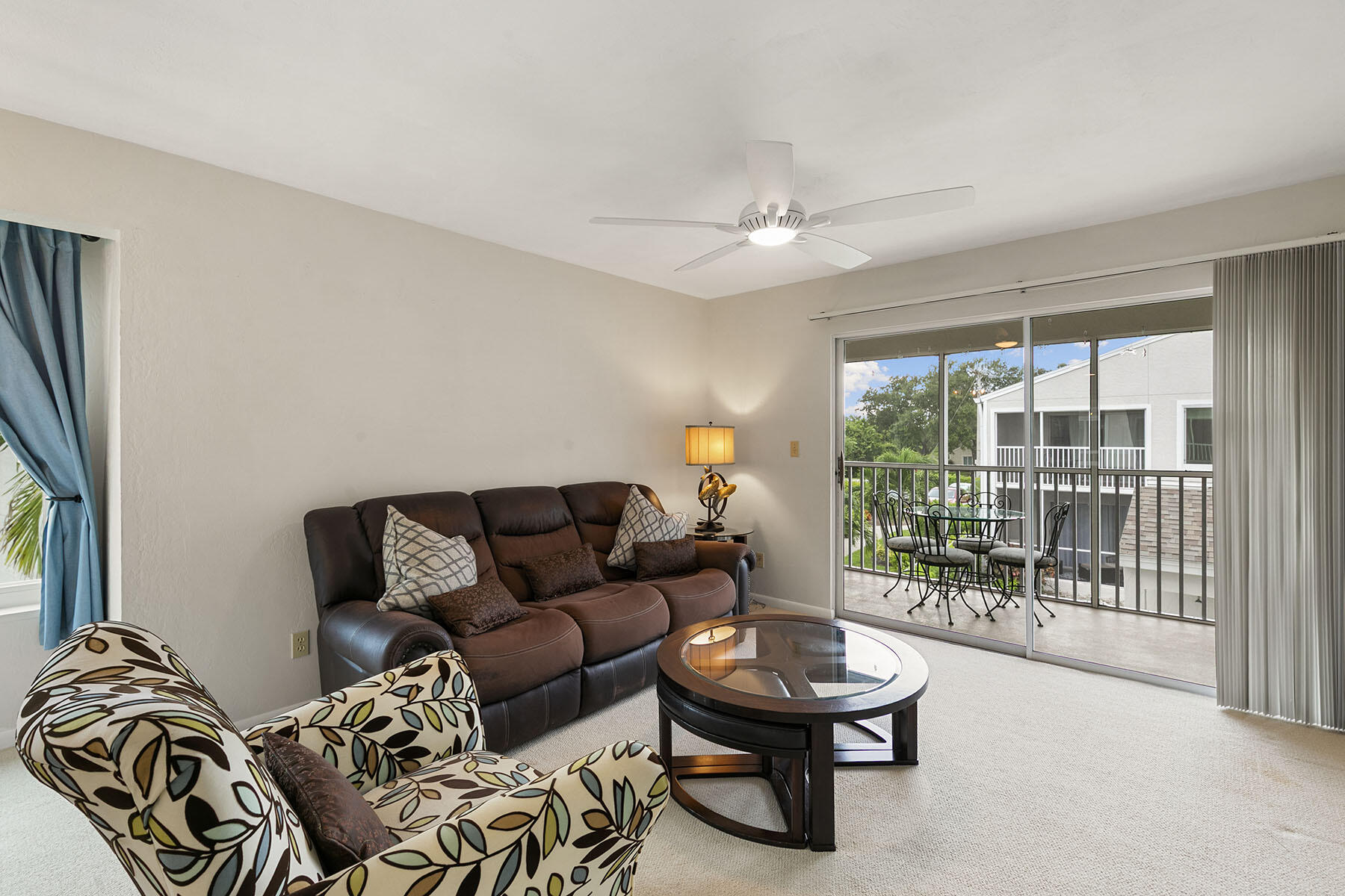 2189 San Marco Road, Unit 201 Marco Island, FL 34145 - Photo 5 of 27 a living room with furniture and a floor to ceiling window