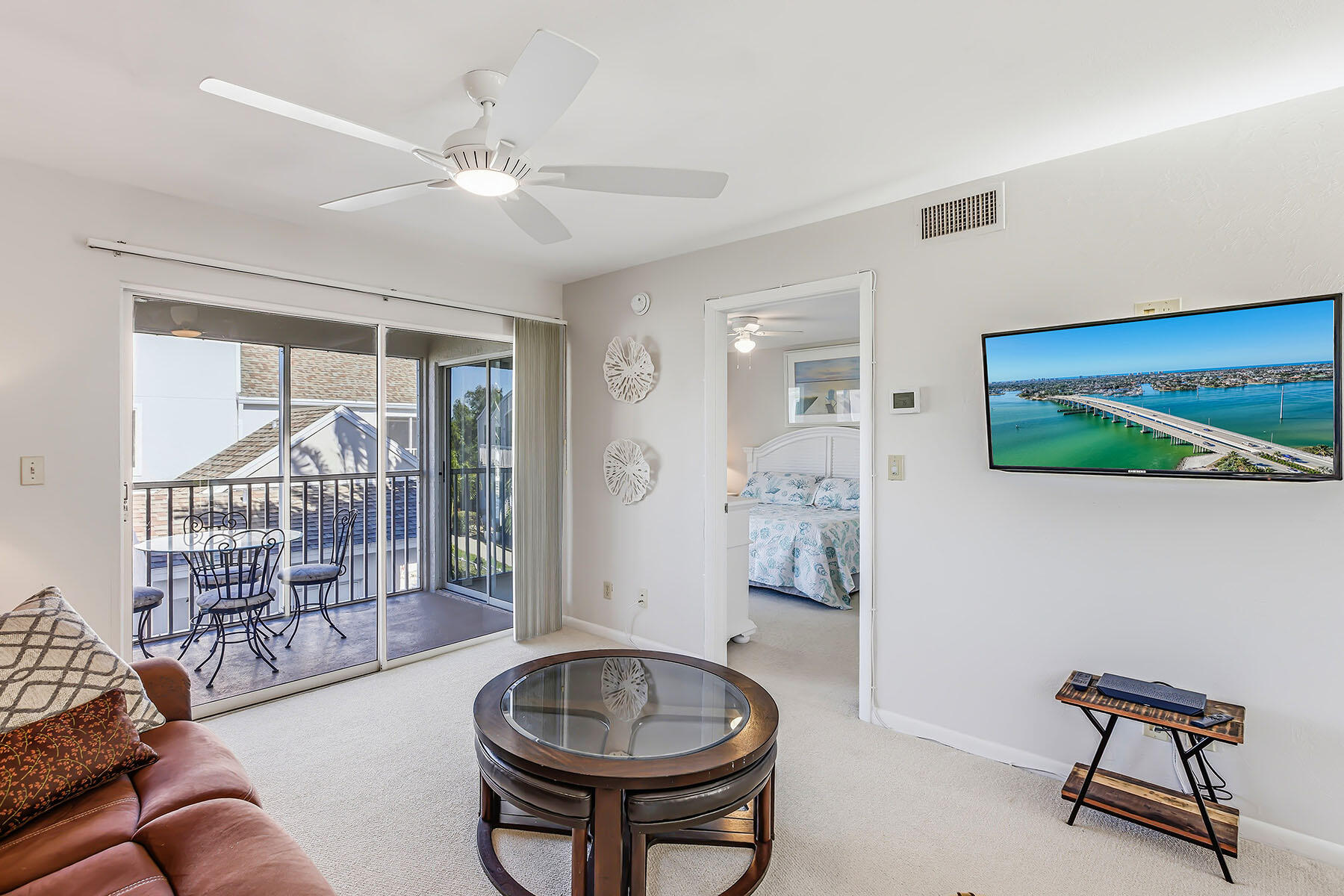 2189 San Marco Road, Unit 201 Marco Island, FL 34145 - Photo 7 of 27 a living room with furniture and a floor to ceiling window