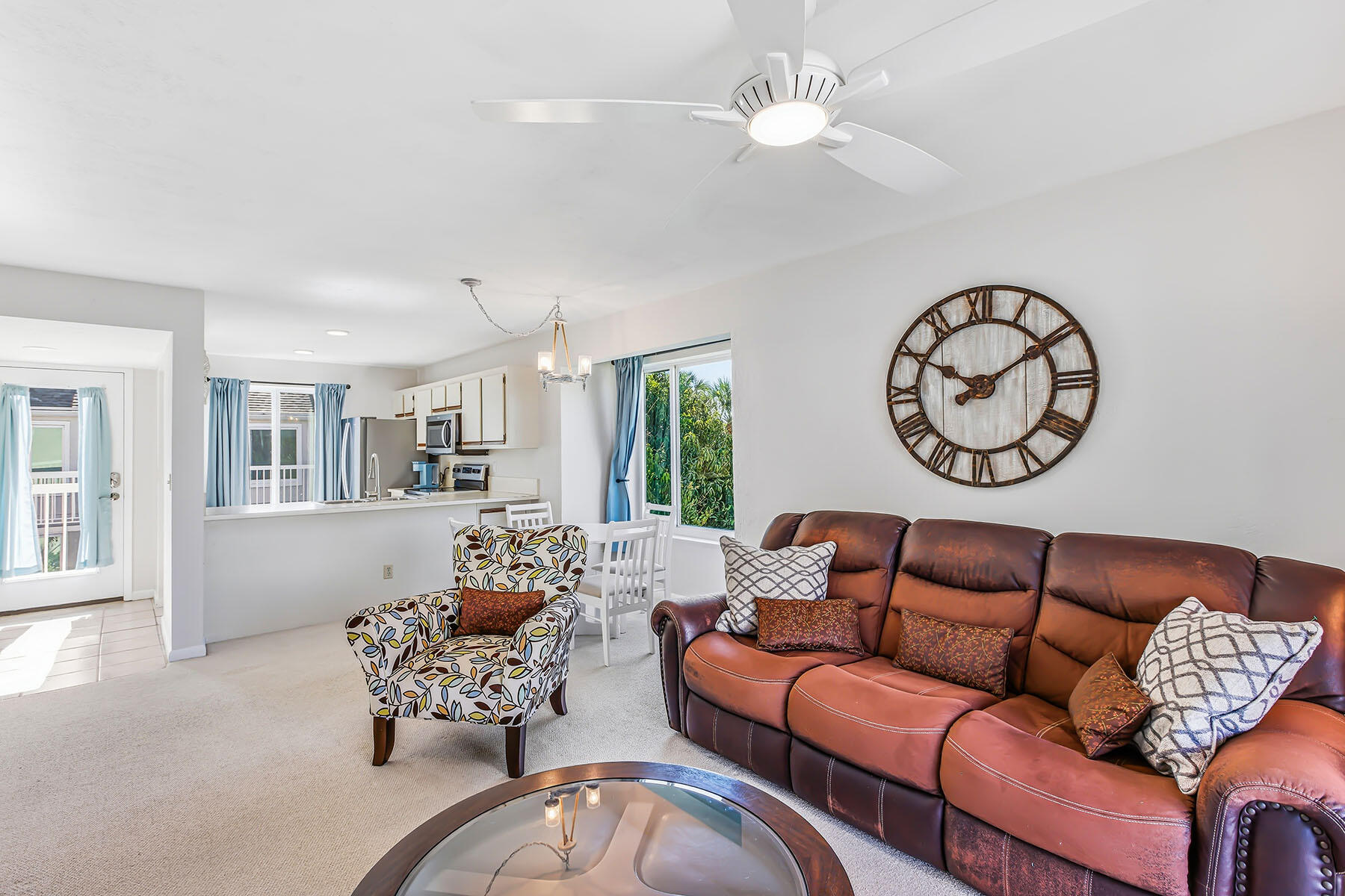 2189 San Marco Road, Unit 201 Marco Island, FL 34145 - Photo 8 of 27 a living room with furniture ceiling fan and a window