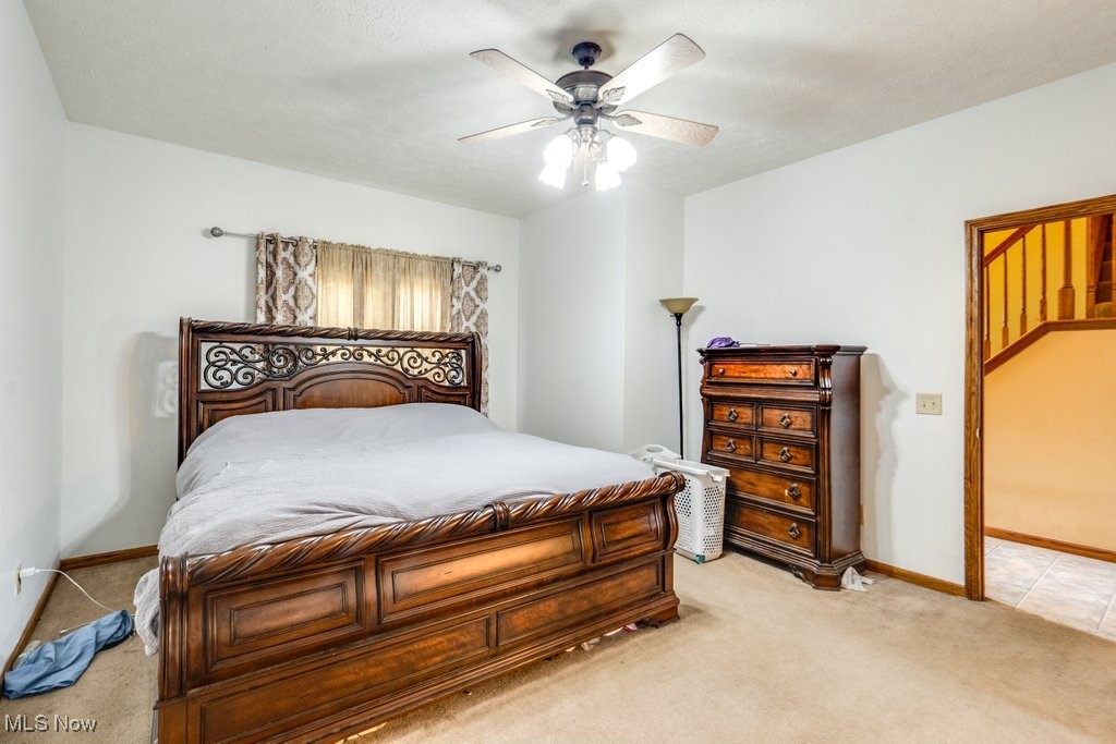 3362 Sunnybrook Road Kent, OH 44240 - Photo 17 of 50 Bedroom featuring light carpet and ceiling fan