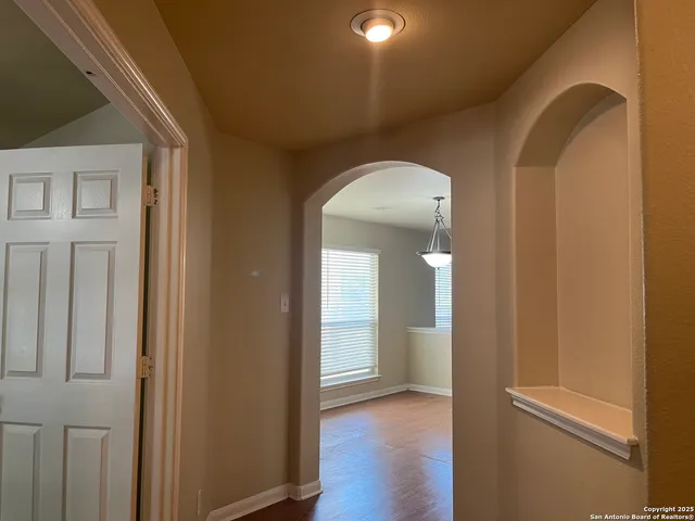 a view of a livingroom with wooden floor