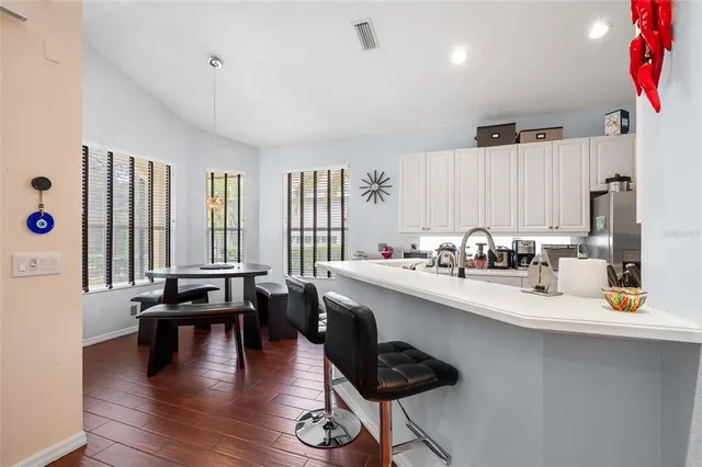 a kitchen with sink and cabinets