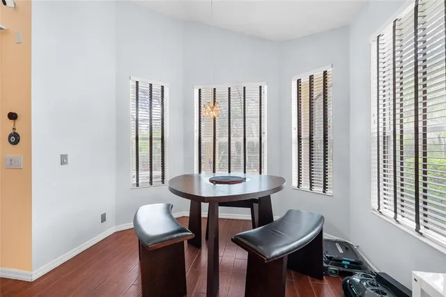 a view of a room with furniture and window