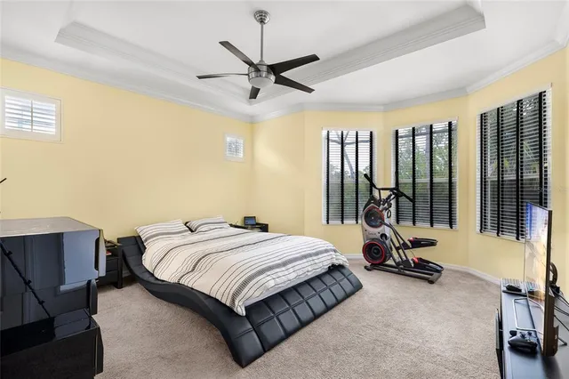 a bed room with a bed and a chair