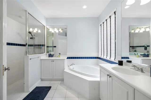 a bathroom with a bathtub and a sink