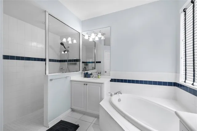 a bathroom with a bathtub and a sink