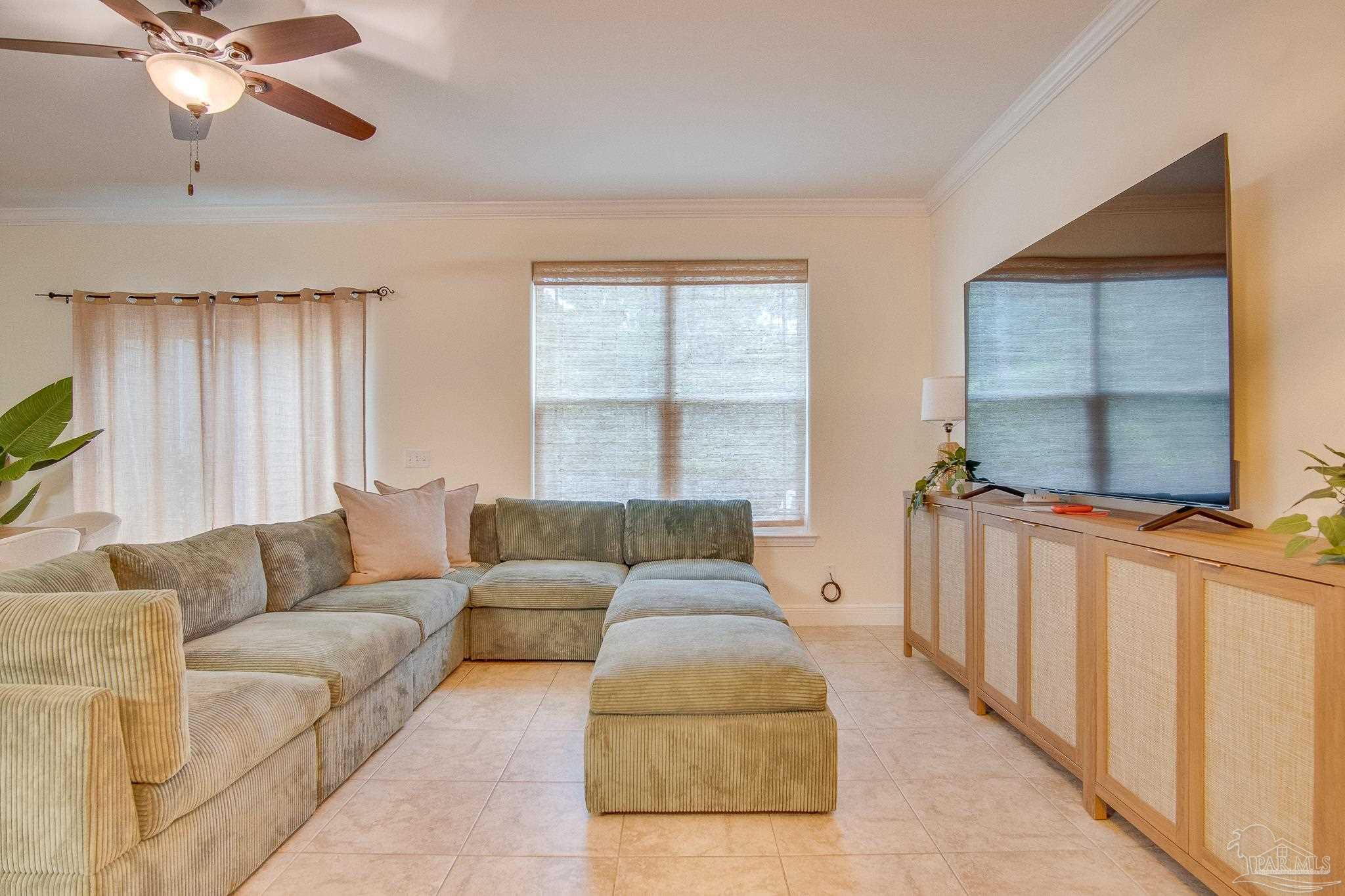 1768 Sound Haven Court Navarre, FL 32566 - Photo 31 of 39 a living room with furniture and a window