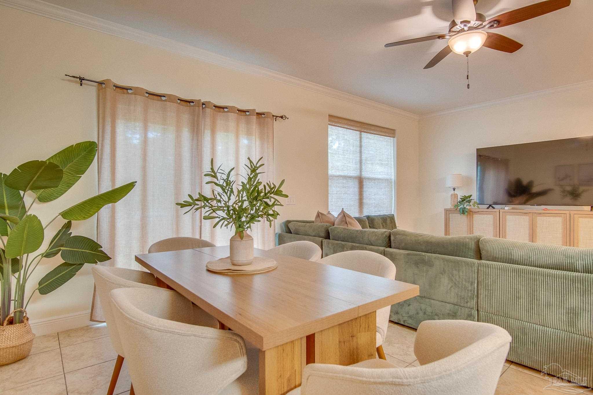 1768 Sound Haven Court Navarre, FL 32566 - Photo 33 of 39 a dining room with furniture and wooden floor