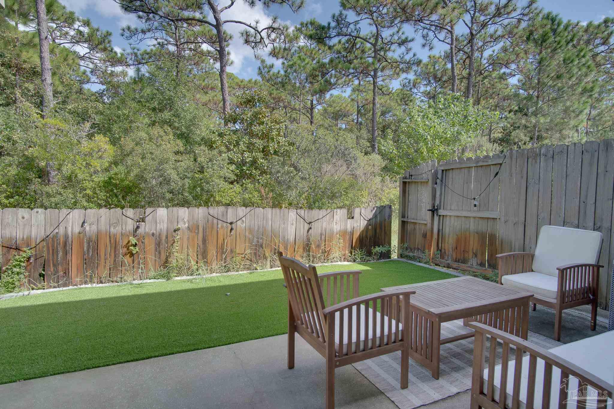 1768 Sound Haven Court Navarre, FL 32566 - Photo 37 of 39 a garden view with a seating space