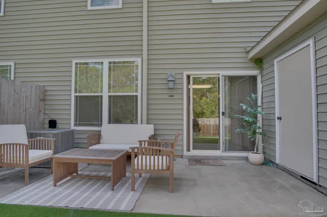 a outdoor view with a sitting space and glass windows