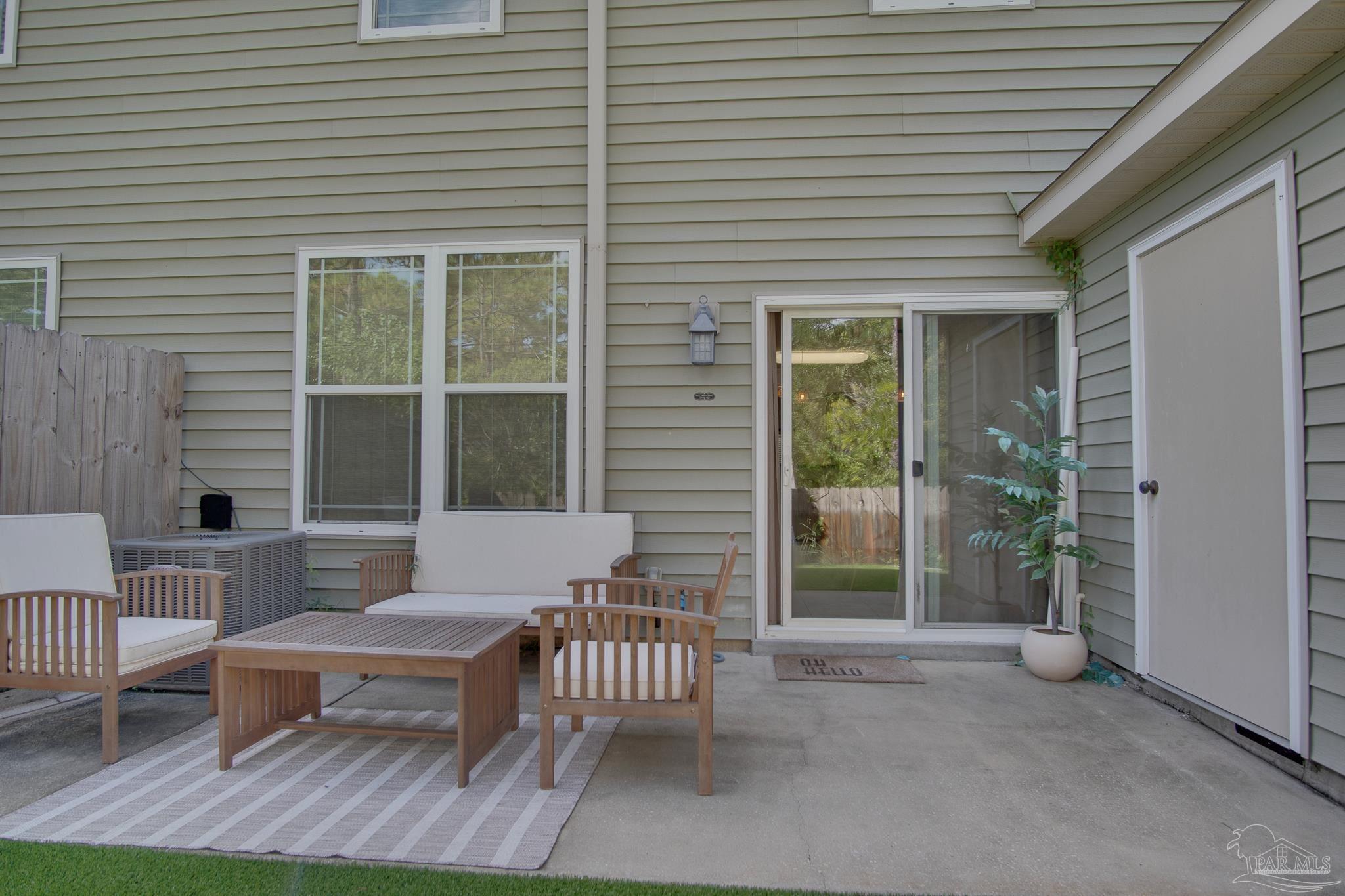 1768 Sound Haven Court Navarre, FL 32566 - Photo 38 of 39 a outdoor view with a sitting space and glass windows