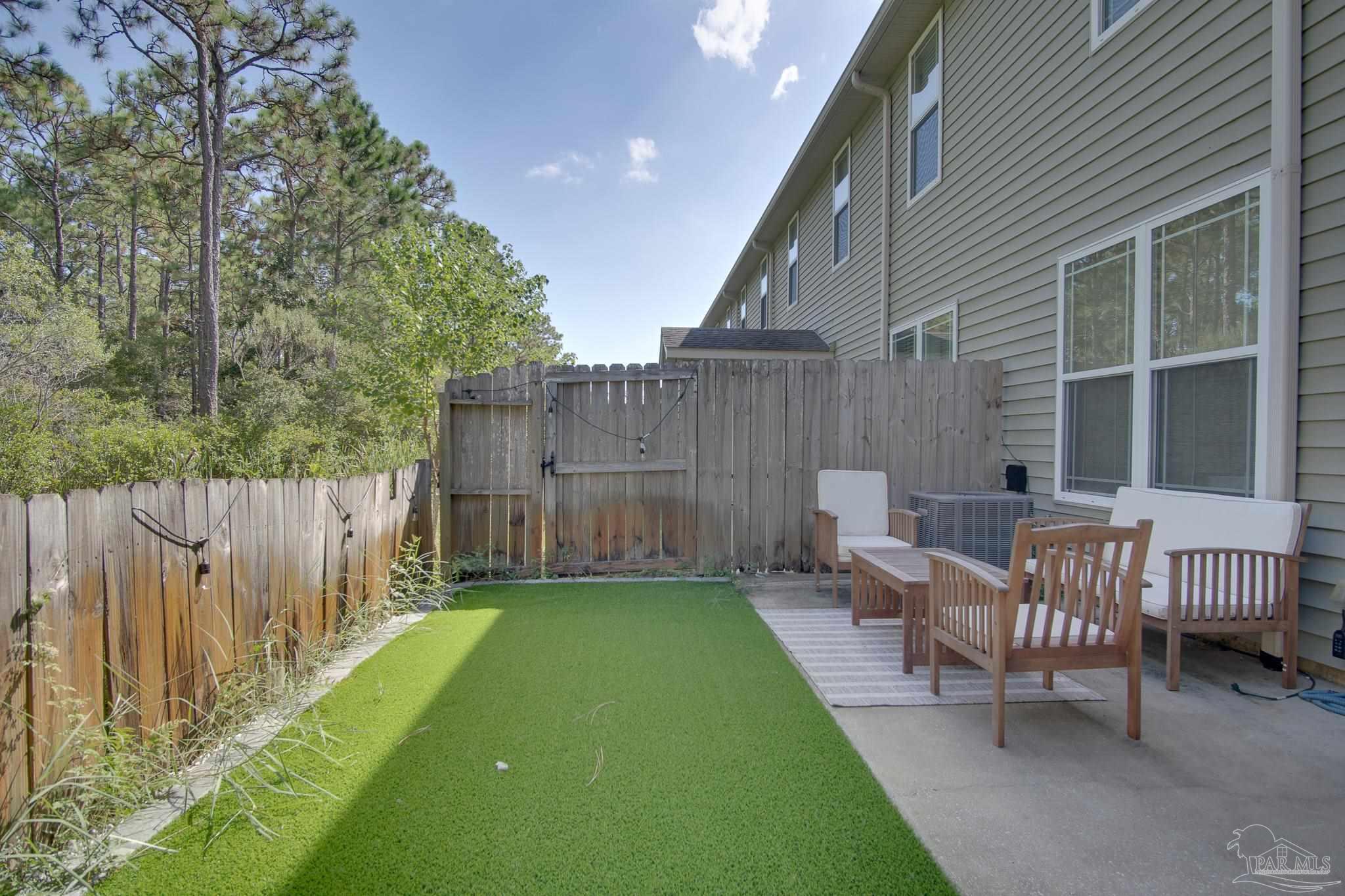 1768 Sound Haven Court Navarre, FL 32566 - Photo 39 of 39 a garden view with a seating space