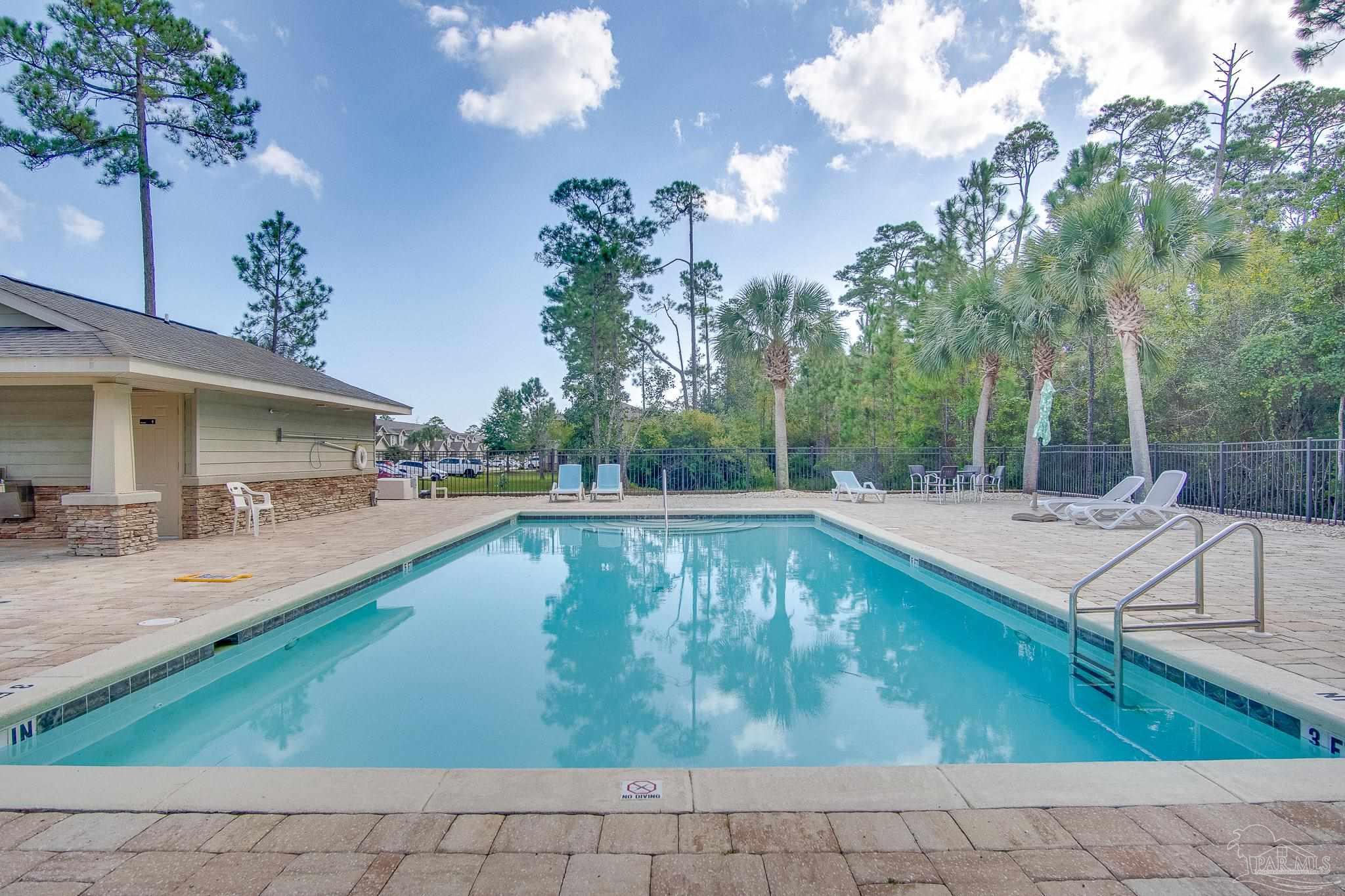 1768 Sound Haven Court Navarre, FL 32566 - Photo 4 of 39 a view of a swimming pool with a patio