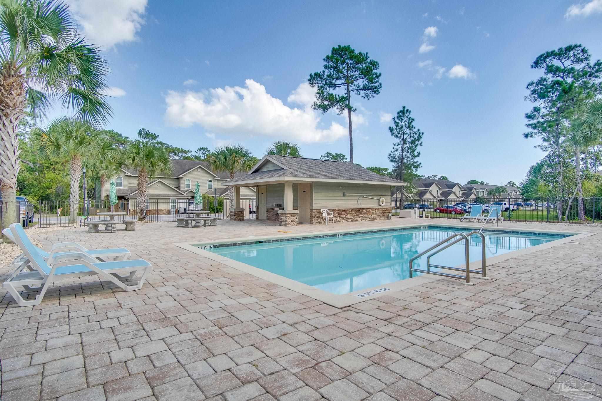 1768 Sound Haven Court Navarre, FL 32566 - Photo 6 of 39 a view of house with outdoor space and swimming pool