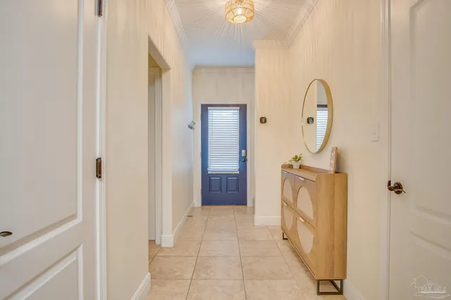 a view of a hallway with entryway wooden floor and front door