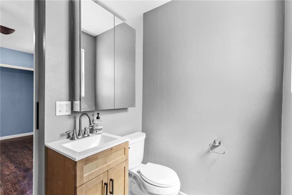 19403 Welby Way Reseda, CA 91335 - Photo 11 of 16 a bathroom with a sink toilet and mirror