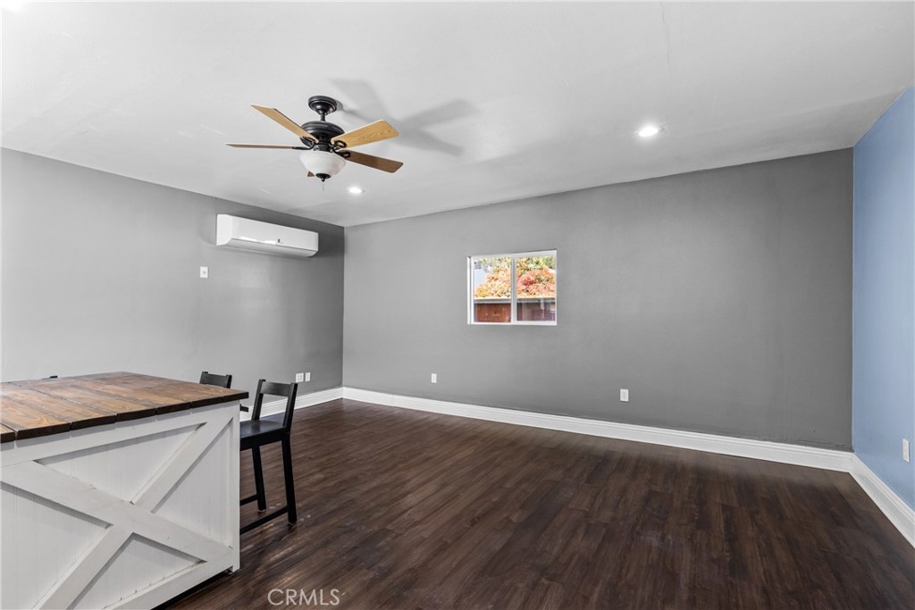 19403 Welby Way Reseda, CA 91335 - Photo 5 of 16 a view of a room with a wooden floor and a ceiling fan