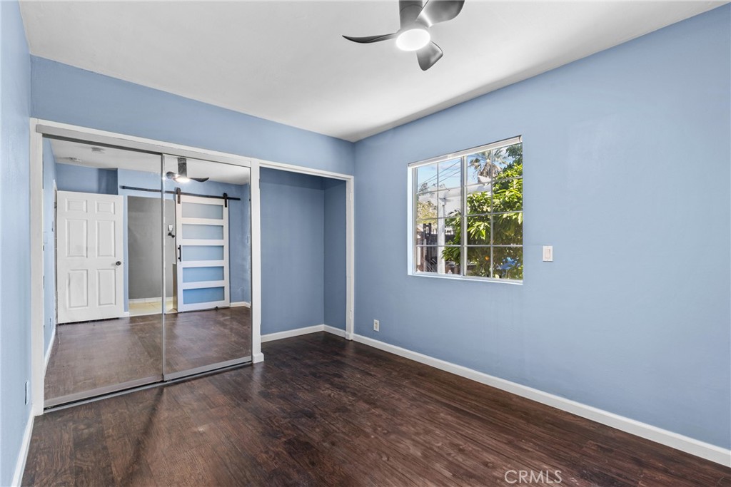 19403 Welby Way Reseda, CA 91335 - Photo 9 of 16 an empty room with windows and closet