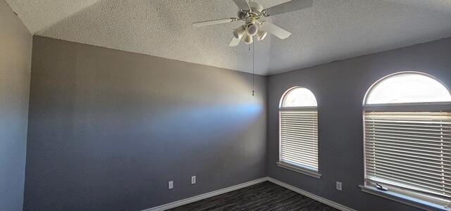 6027 100th Street Lubbock, TX 79424 - Photo 11 of 11 an empty room with windows and fan