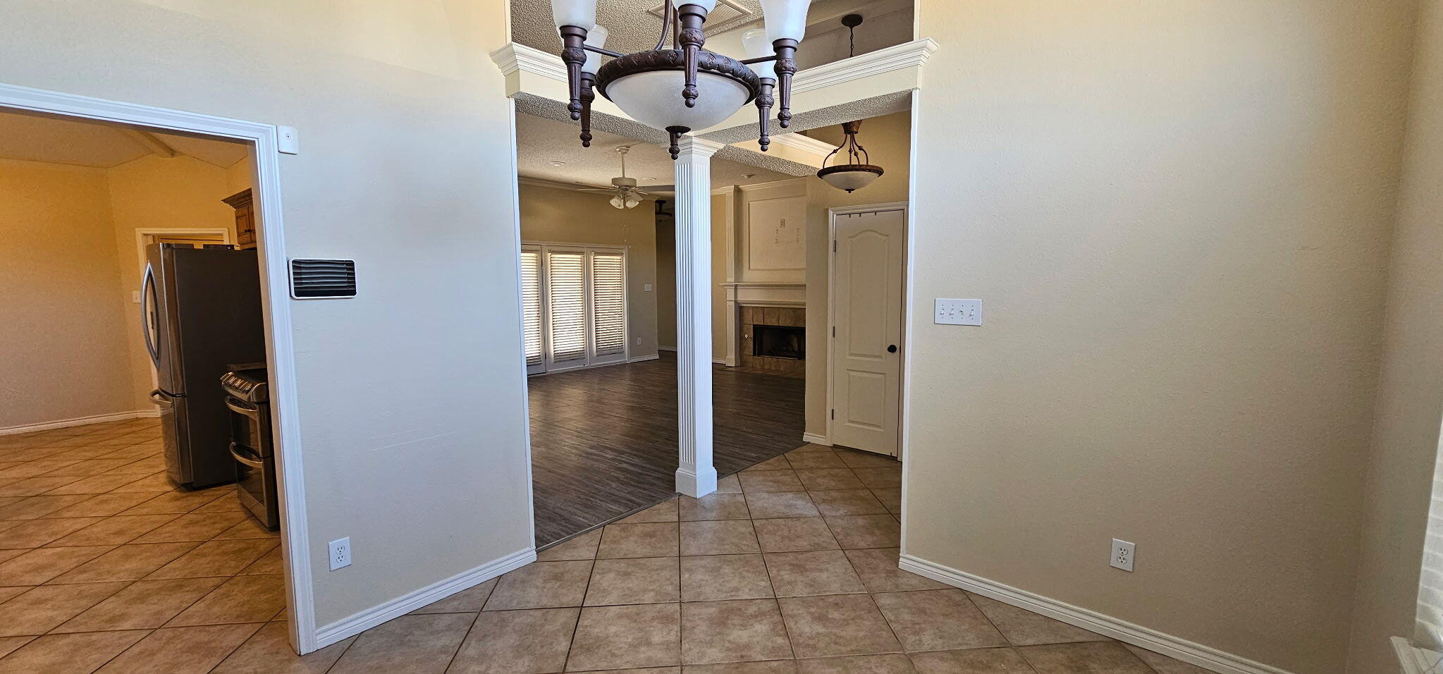 6027 100th Street Lubbock, TX 79424 - Photo 9 of 11 a view of a hallway with wooden shelves