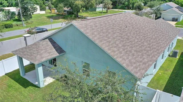 an aerial view of a house having yard