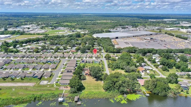 an aerial view of residential building and lake
