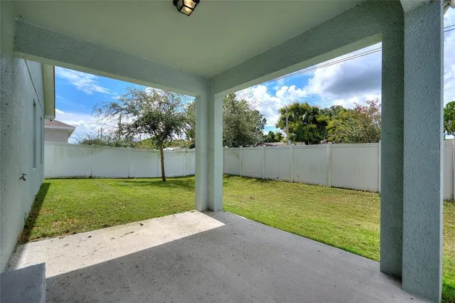 a view of back yard from a balcony