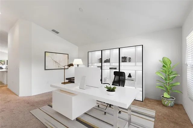 a room with table and potted plant