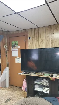 a view of room with a flat screen tv