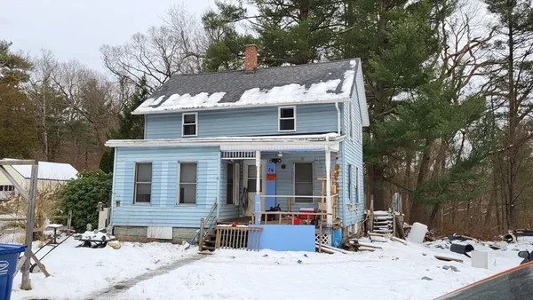 a view of a house with snow on the roof