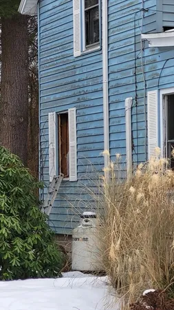 a view of entrance of the house with yard