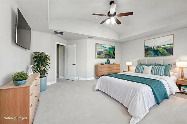 a spacious bathroom with double sink and a large mirror