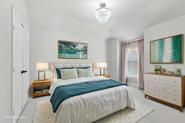 a bathroom with a double vanity sink toilet mirror and bathtub