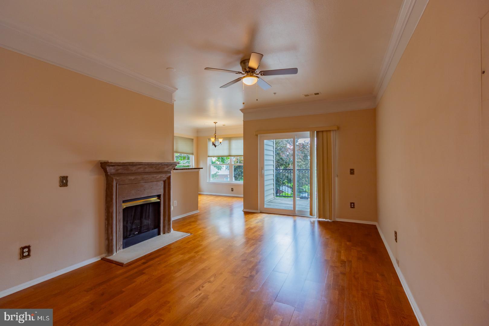 1600 Spring Gate Dr., Unit 2207 McLean, VA 22102 - Photo 4 of 32 wooden floor fireplace and natural light in a room