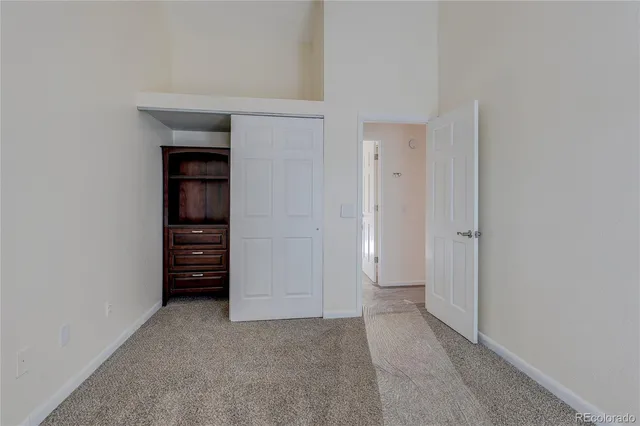 a view of an empty room and fire place