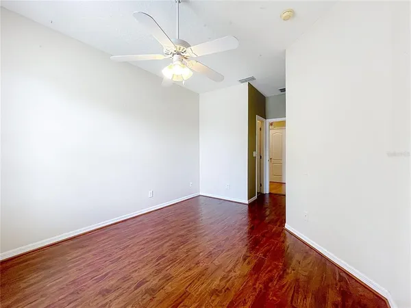 a bedroom with a bed and a television