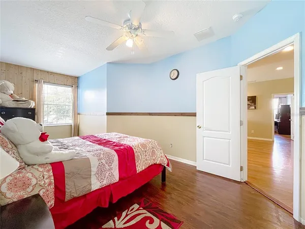 a view of walk in closet with clothes
