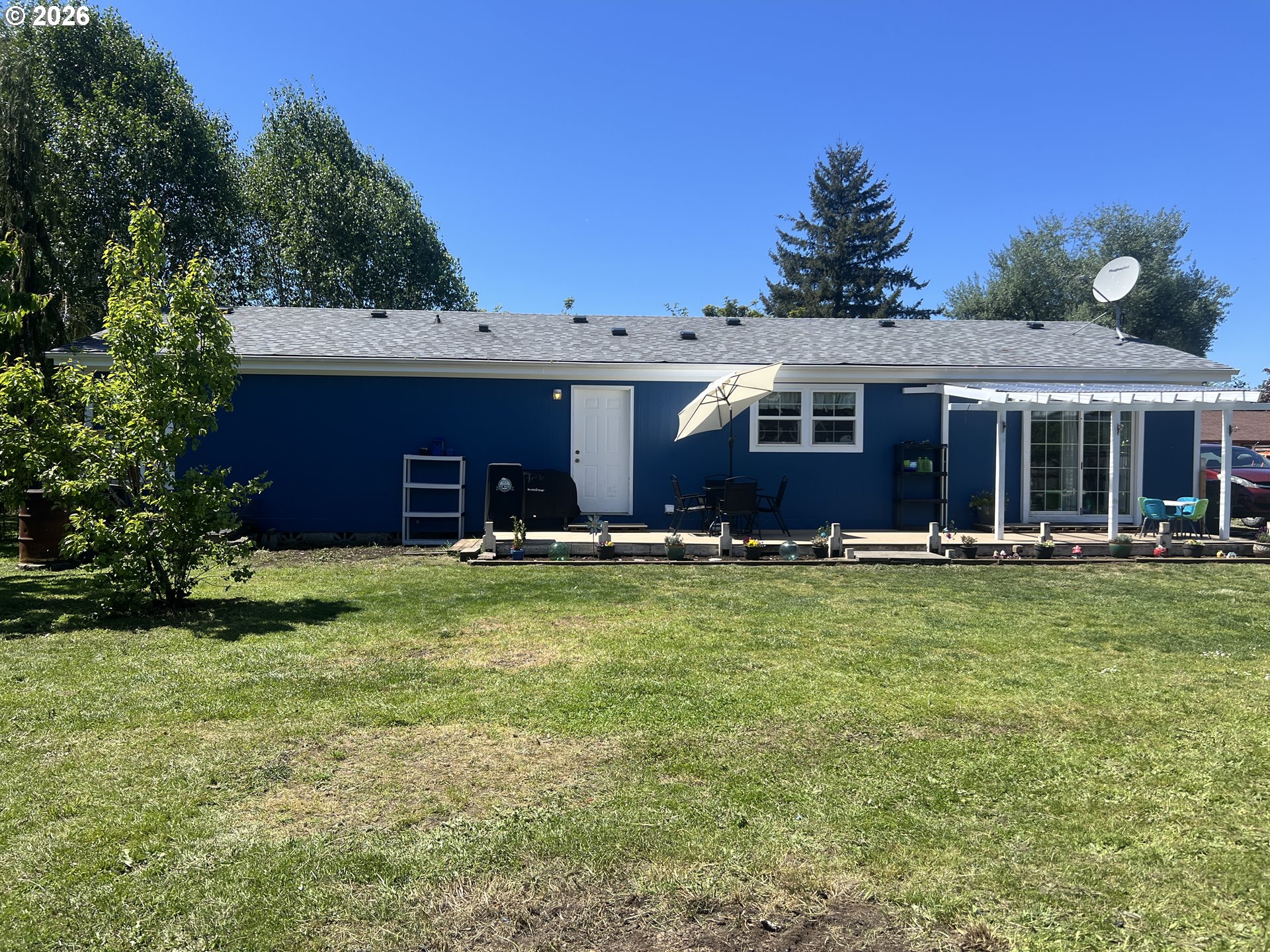 210 Northwest Grinstead Street Siletz, OR 97380 - Photo 29 of 29 a front view of a house with a garden