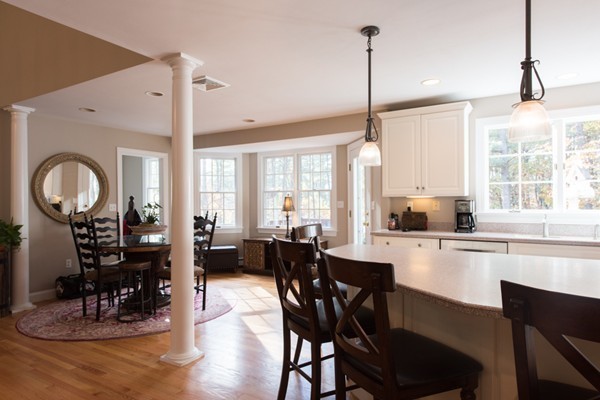 108 Flint Farm Road Middleton, MA 01949 - Photo 11 of 30 a kitchen with counter space dining table and stainless steel appliances