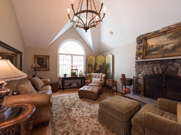 108 Flint Farm Road Middleton, MA 01949 - Photo 13 of 30 a living room with furniture a fireplace and a flat screen tv