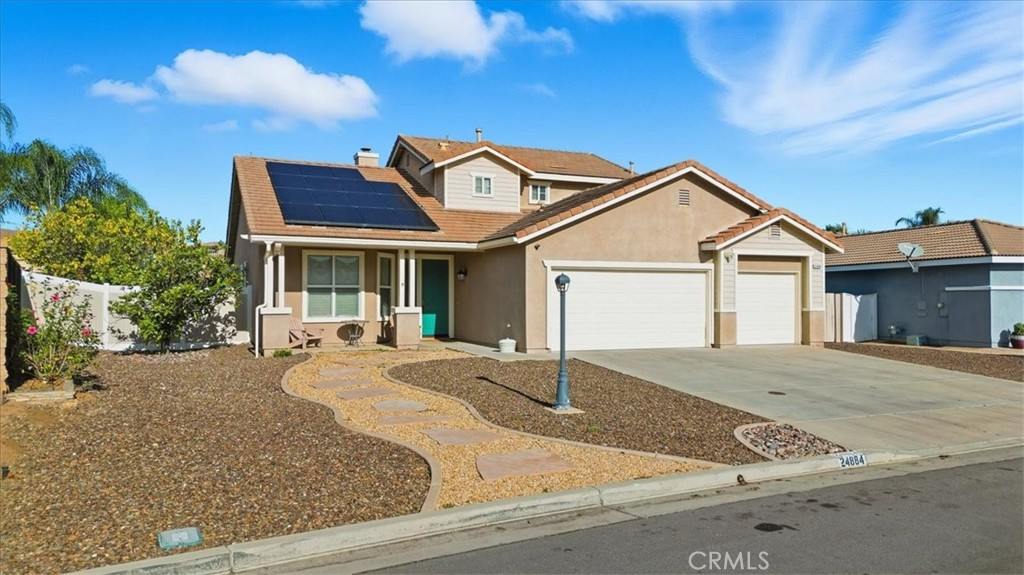 a front view of a house with yard