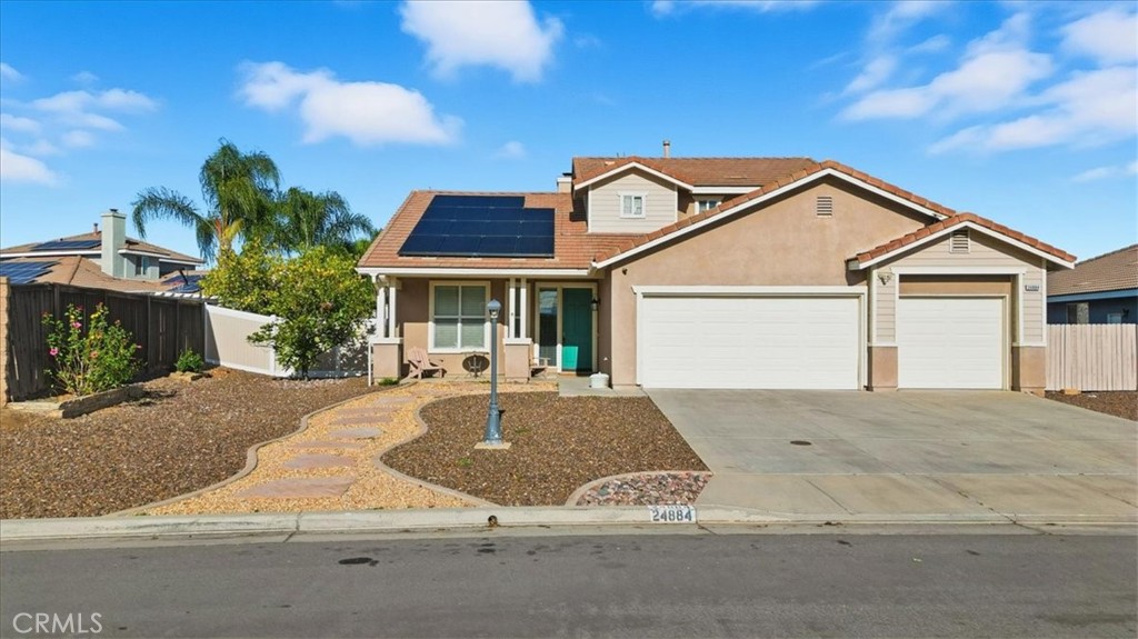 24884 Butterchurn Road Wildomar, CA 92595 - Photo 2 of 43 a front view of a house with garden