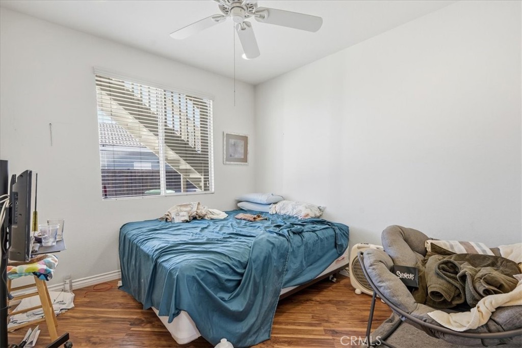 24884 Butterchurn Road Wildomar, CA 92595 - Photo 23 of 43 a bedroom with bed and a window