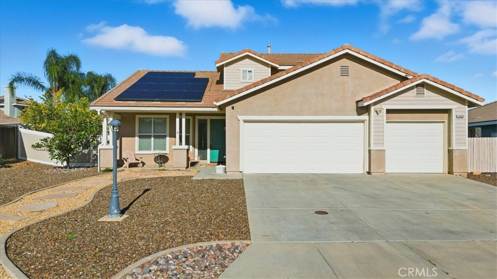 24884 Butterchurn Road Wildomar, CA 92595 - Photo 28 of 43 a view of a house with a small yard and plants