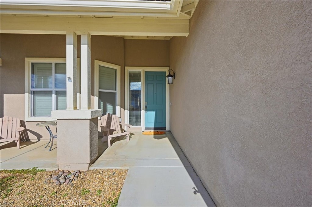 24884 Butterchurn Road Wildomar, CA 92595 - Photo 29 of 43 a view of a patio with a table and chairs