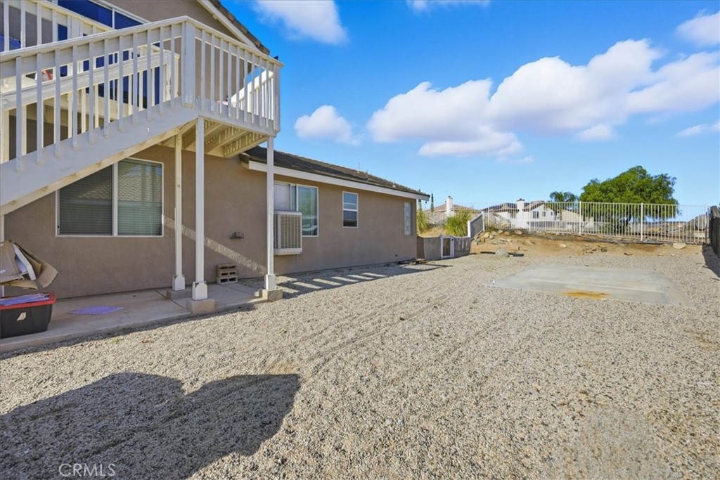 24884 Butterchurn Road Wildomar, CA 92595 - Photo 32 of 43 a view of a house with a patio