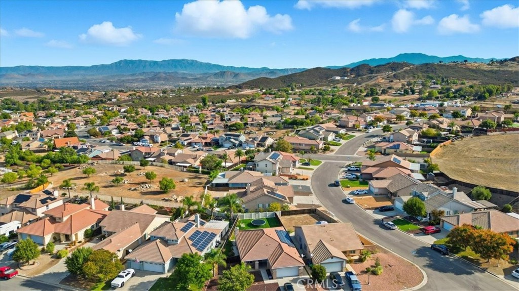 24884 Butterchurn Road Wildomar, CA 92595 - Photo 41 of 43 an aerial view of residential houses with outdoor space and trees